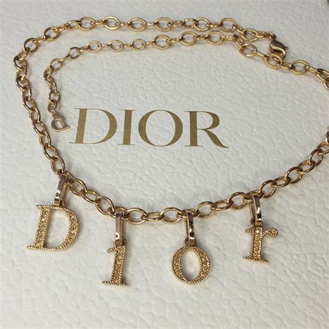 dior gold bow necklace|dior necklace gold letters.